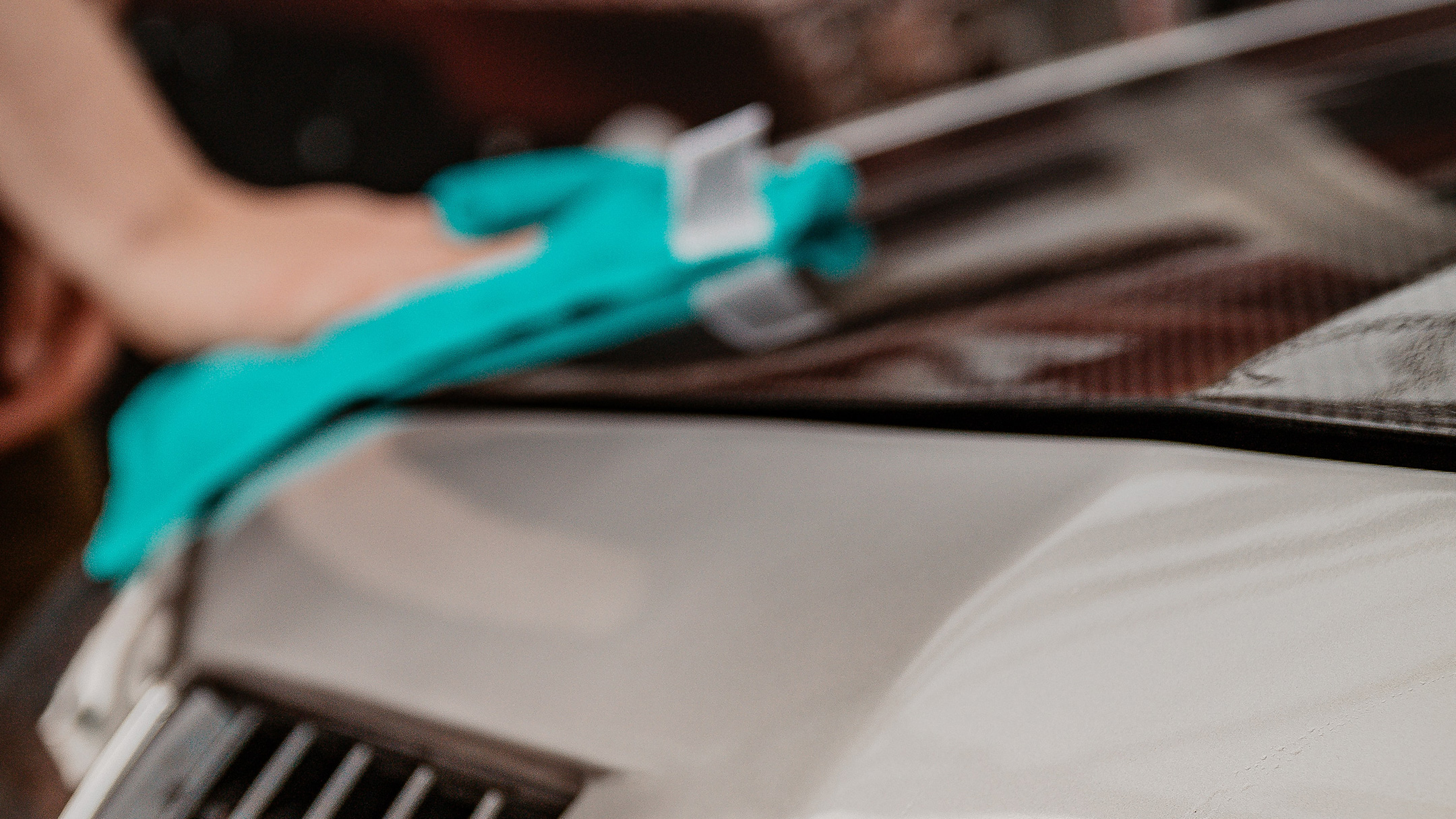 Picture of man hand washing car