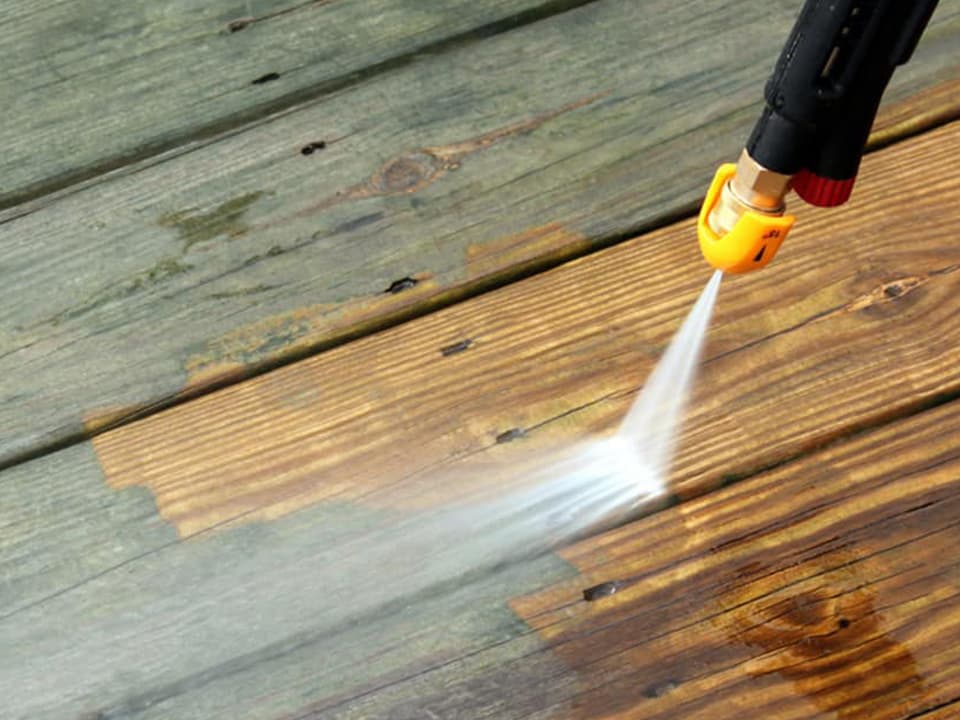 Picture of deck before and after professional pressure washing